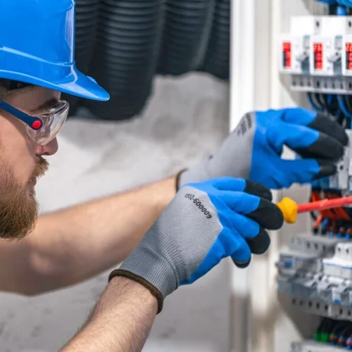 electrician diagnosing electrical fault in fuse box london